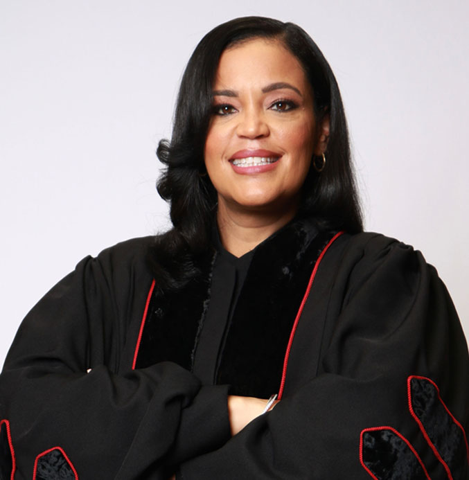 A headshot of Rev. Dr. Danielle Brown in a clergy robe.